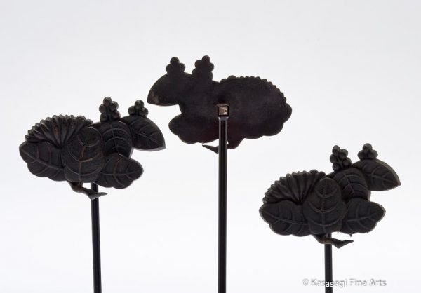 Three Kugikakushi Decorative Nail Covers on Custom Stands