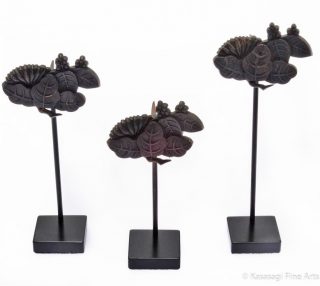 Three Kugikakushi Decorative Nail Covers on Custom Stands